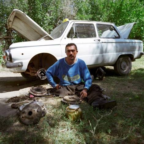 Mahmad Khudoiev lost his leg after a cluster bomb strike in Tajikistan, 1993. Mahmad was eventually able to return to his job as a taxi driver after adapting his car to be controlled by hand. Photo credit: © Alison Locke