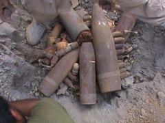 Numerous DPICM submunitions are among several types of dud surface-fired ordnance photographed in a district of Sa’ada Governorate near the border of Yemen and Saudi Arabia in July 2013. Photo courtesy of the Executive Committee Office of the Houthi Administration.